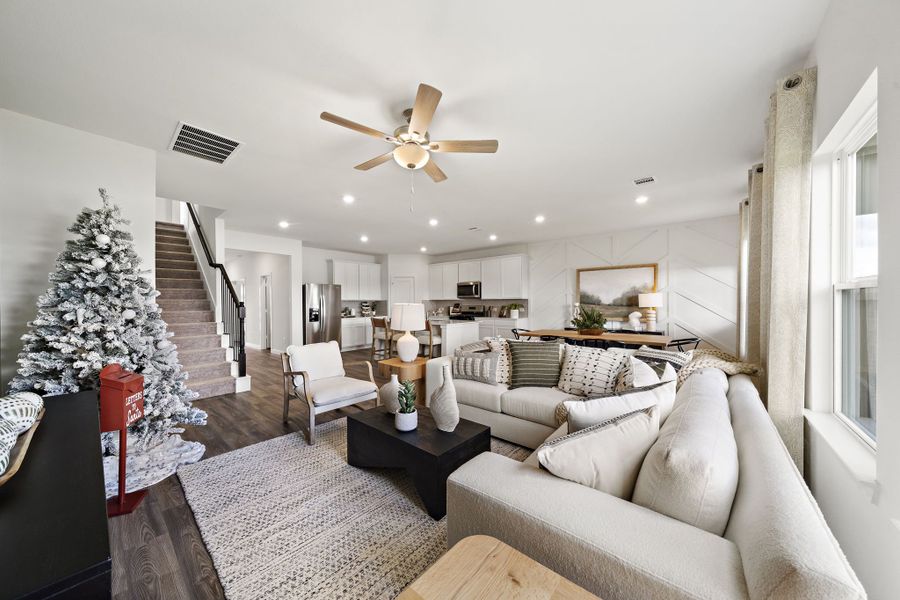 A living room with a christmas tree. A living room with a christmas tree.