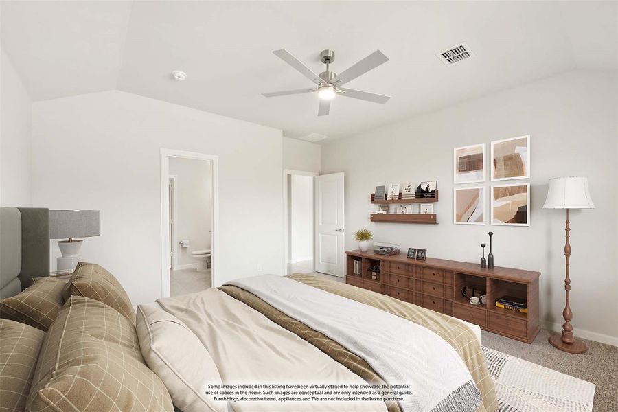 Bedroom with ceiling fan, carpet flooring, wood dresser, and ensuite bathroom doorway visible in background