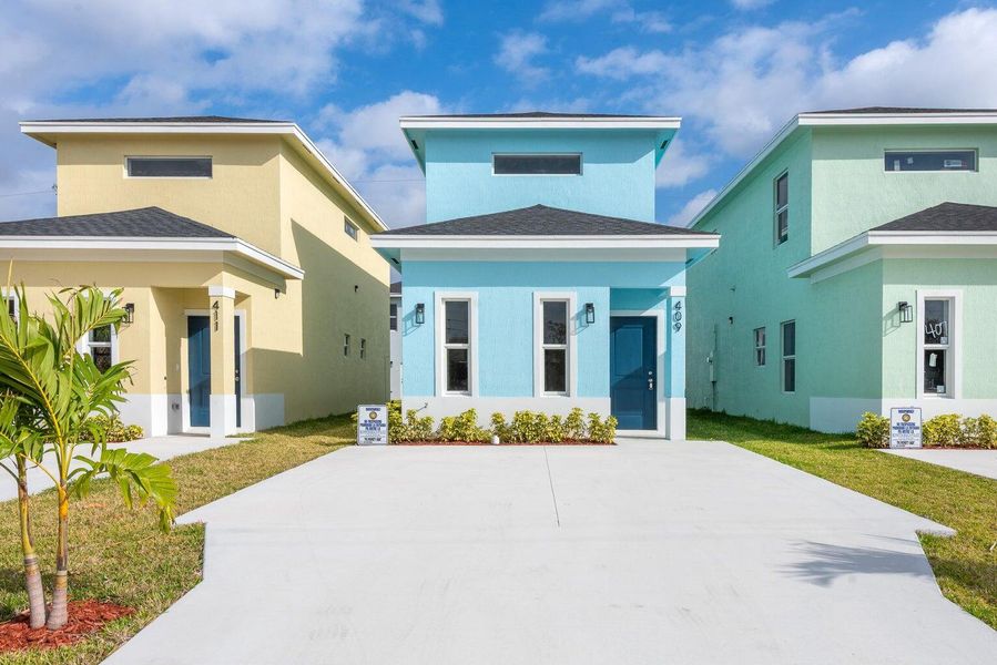 Front exterior of a new home in , Boynton Beach, FL, highlighting curb appeal (Image 1).