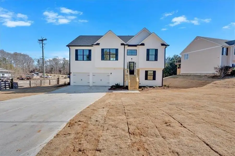 Front exterior of a new home in , Rome, GA, highlighting curb appeal (Image 2). Front exterior of a new home in , Rome, GA, highlighting curb appeal (Image 2).