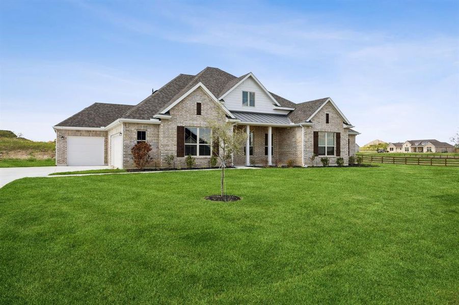 Craftsman-style home with a standing seam roof, brick siding, a metal roof, a porch, and a shingled roof