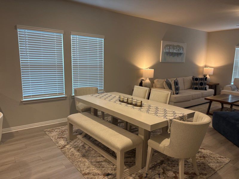 This seamless floorplan integrates a dining area with views into the comfortable living space.