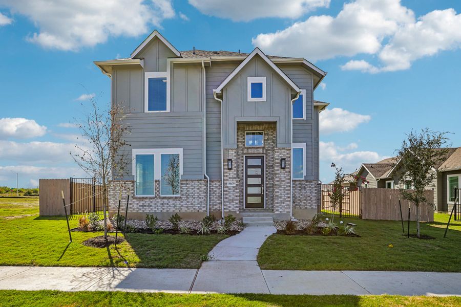 Front exterior of a new home in Easton Park, Austin, TX, highlighting curb appeal (Image 1). Front exterior of a new home in Easton Park, Austin, TX, highlighting curb appeal (Image 1).