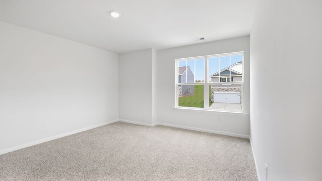 Spacious, unfurnished interior of a new home in Durbin Meadows Traditions, Fountain Inn (Image 31).