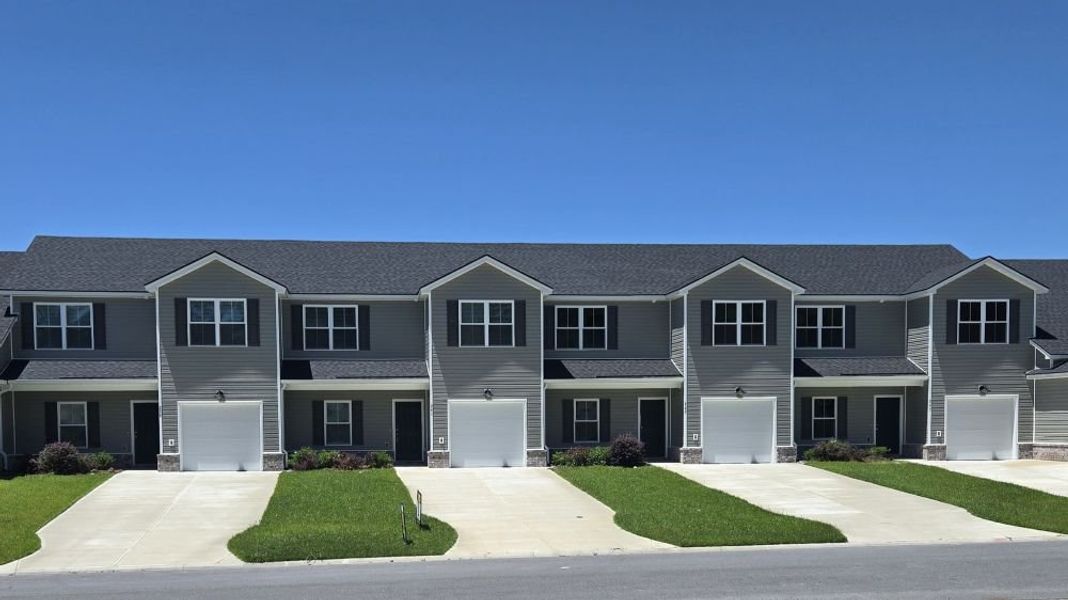 Front exterior of a new home in New Haven At Belmont Glen, Guyton, GA, highlighting curb appeal (Image 2). Front exterior of a new home in New Haven At Belmont Glen, Guyton, GA, highlighting curb appeal (Image 2).