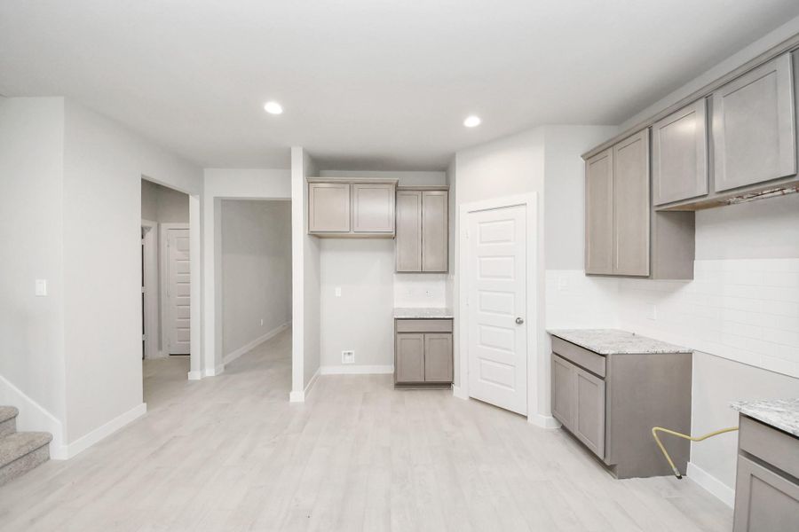 This generously spacious kitchen is a dream realized! Sample photo of completed home with similar floor plan. Actual colors and selections may vary. This generously spacious kitchen is a dream realized! Sample photo of completed home with similar floor plan. Actual colors and selections may vary.