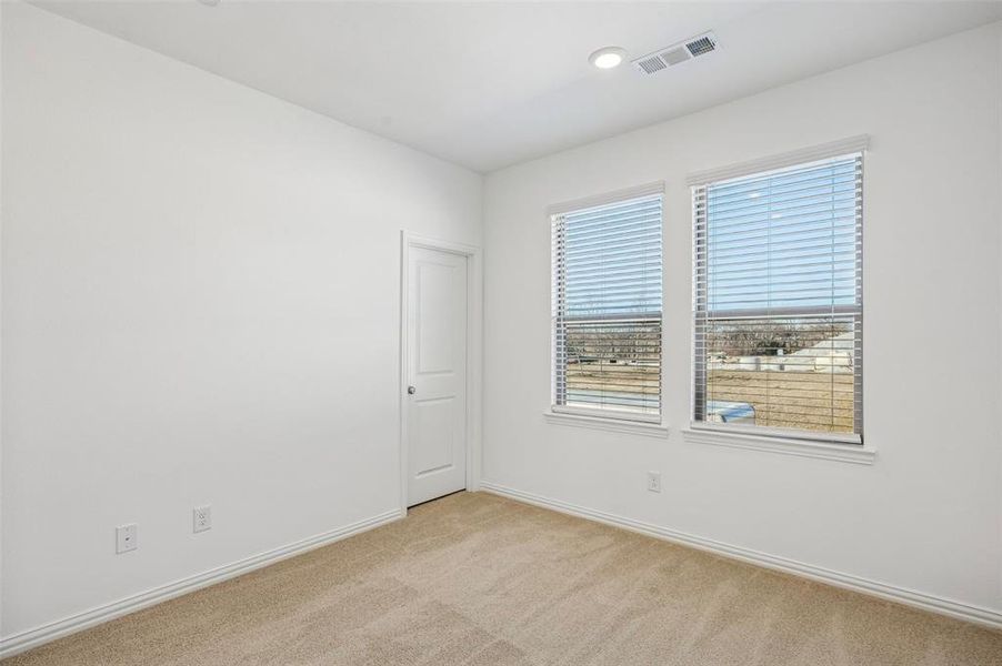 One of two spacious secondary bedrooms in our Tatum floor plan.
