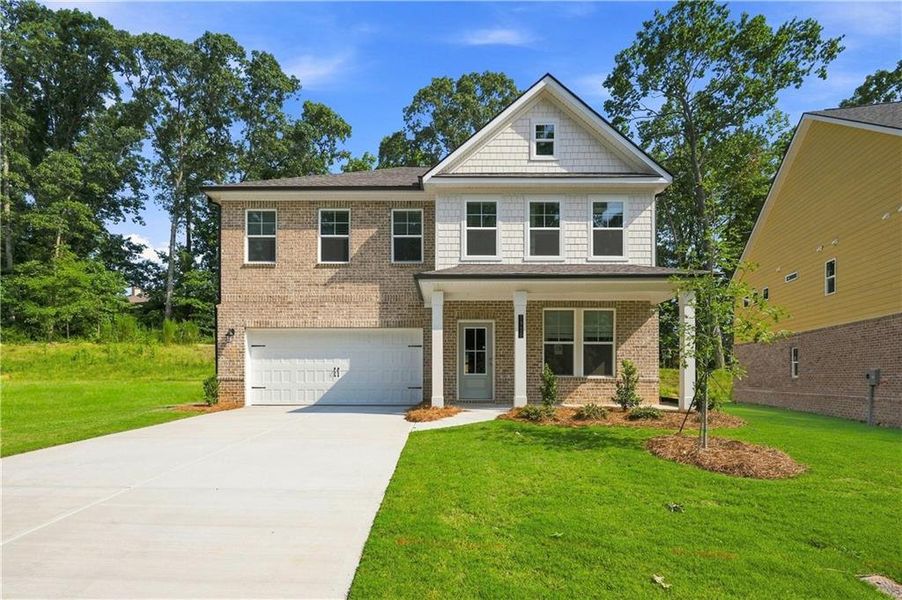 Front exterior of a new home in Hamilton Lakes, Lawrenceville, GA, highlighting curb appeal (Image 2). Front exterior of a new home in Hamilton Lakes, Lawrenceville, GA, highlighting curb appeal (Image 2).