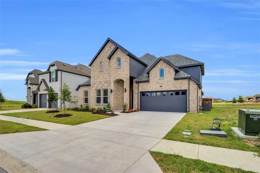 Front exterior of a new home in Polo Ridge, Forney, TX, highlighting curb appeal (Image 26).