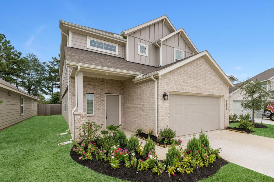 Front exterior of a new home in Venetian Pines, Conroe, TX, highlighting curb appeal (Image 2).
