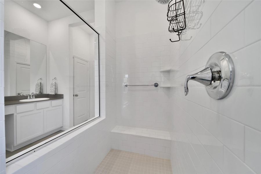 this ensuite bath provides you a large walk in shower