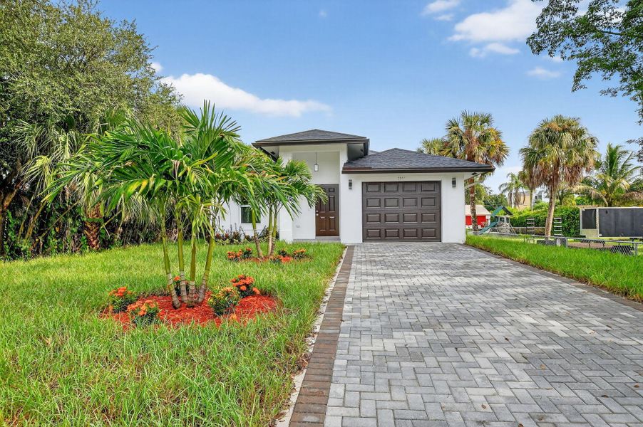 Front exterior of a new home in , West Palm Beach, FL, highlighting curb appeal (Image 14).