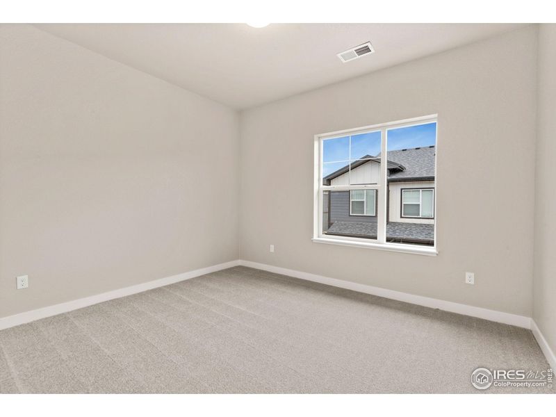 Spacious, unfurnished interior of a new home in The Lakes at Centerra - Discovery, Loveland (Image 16).