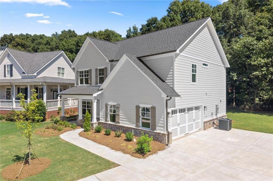 Front exterior of a new home in , Covington, GA, highlighting curb appeal (Image 21).