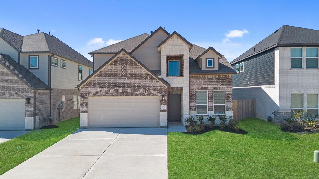 Front exterior of a new home in Barton Creek Ranch, Conroe, TX, highlighting curb appeal (Image 15).