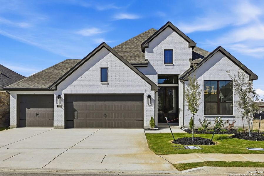 Front exterior of a new home in Ventana - 60', Bulverde, TX, highlighting curb appeal (Image 1).