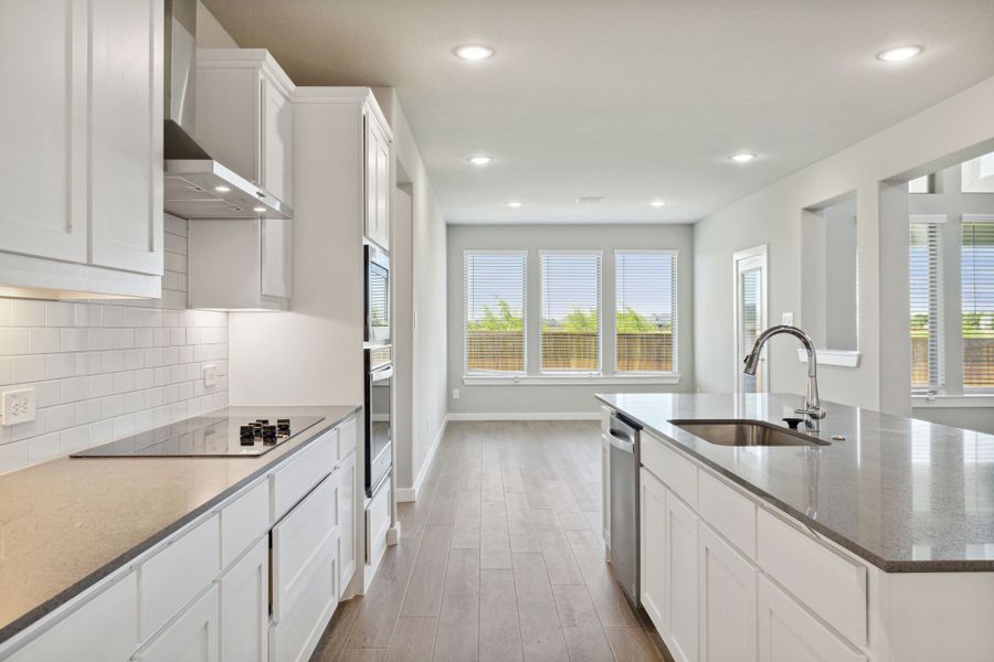 Kitchen in the Henley home plan by Trophy Signature Homes – REPRESENTATIVE PHOTO