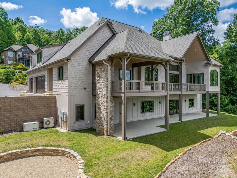 Front exterior of a new home in , Zirconia, NC, highlighting curb appeal (Image 26). Front exterior of a new home in , Zirconia, NC, highlighting curb appeal (Image 26).