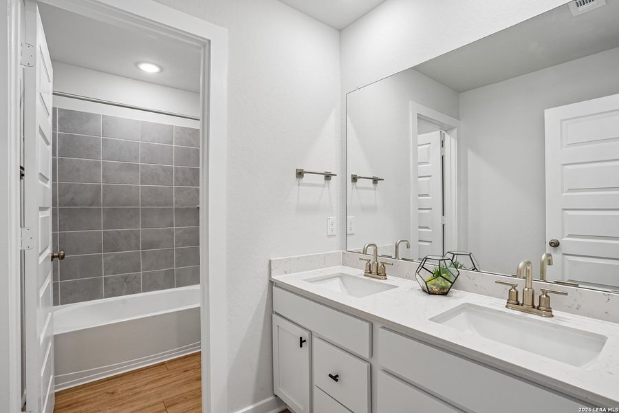 Furnished interior view inside a new home in University Village, San Antonio (Image 21).