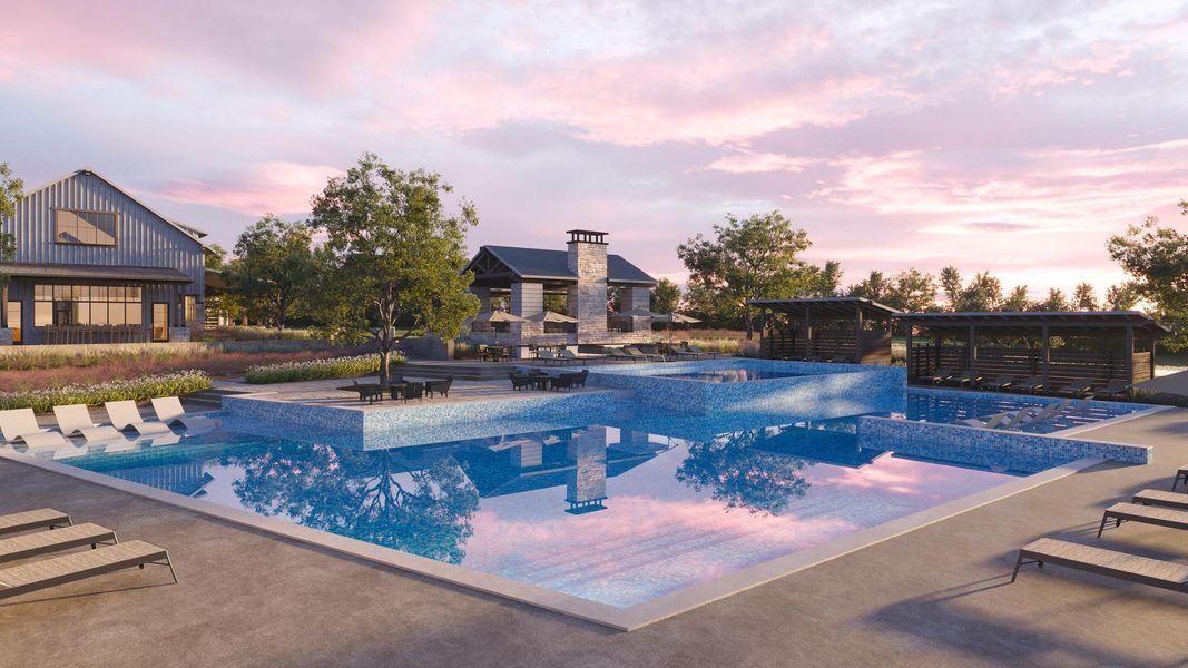 Pool at dusk with a patio and a pool with connected hot tub
