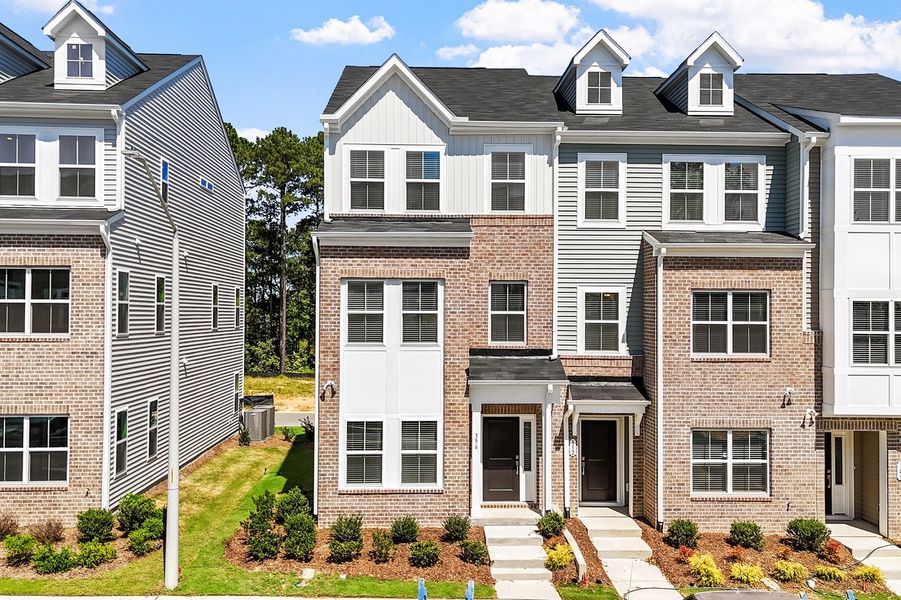 Front exterior of a new home in Renaissance at White Oak, Garner, NC, highlighting curb appeal (Image 1). Front exterior of a new home in Renaissance at White Oak, Garner, NC, highlighting curb appeal (Image 1).