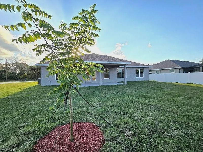 Front exterior of a new home in Greenbriar, Lehigh Acres, FL, highlighting curb appeal (Image 10).