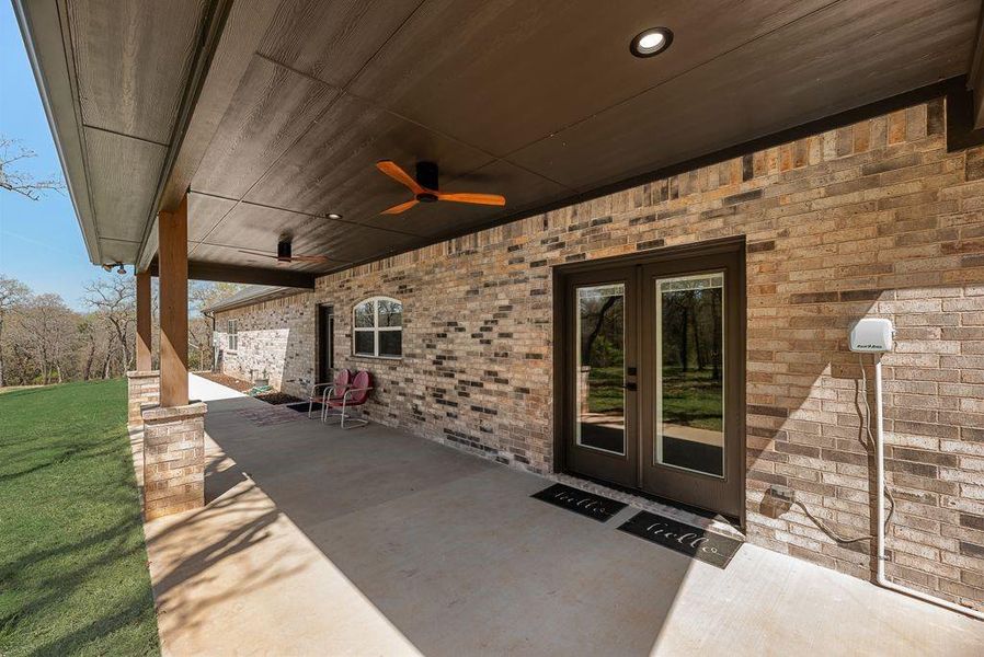 Huge Back Covered Porch with ceiling fans, custom lighting and more!