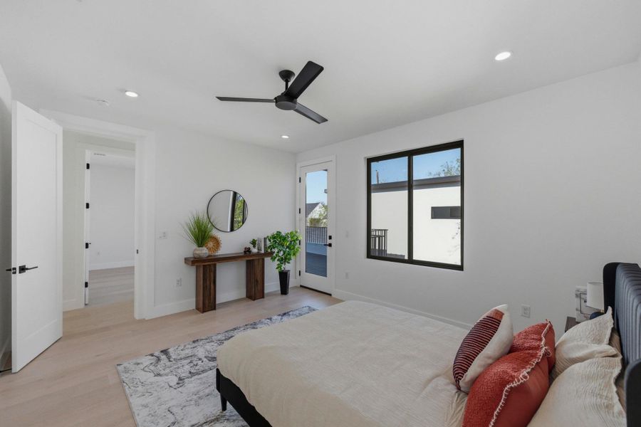 Bedroom featuring access to outside, light wood-type flooring, ceiling fan, and recessed lighting
