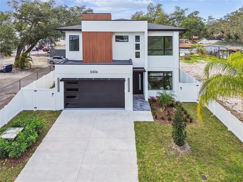 Front exterior of a new home in , Tampa, FL, highlighting curb appeal (Image 23).