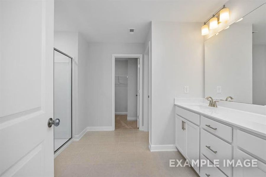 Bathroom with vanity and tile patterned floors