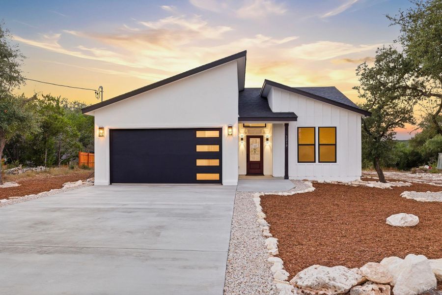 Front exterior of a new home in , Fischer, TX, highlighting curb appeal (Image 2). Front exterior of a new home in , Fischer, TX, highlighting curb appeal (Image 2).