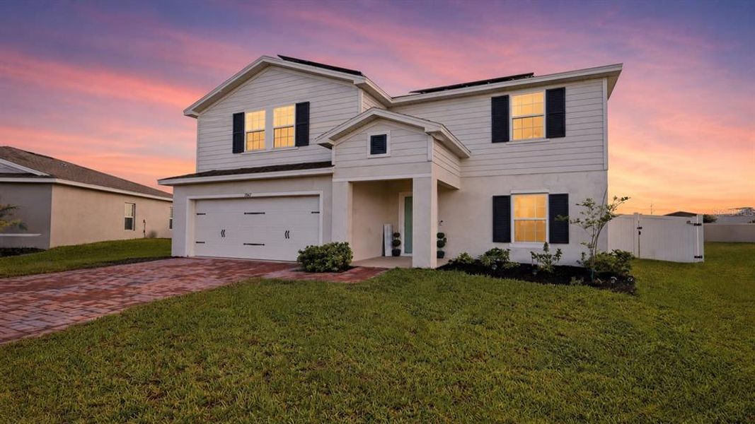 Front exterior of a new home in , Haines City, FL, highlighting curb appeal (Image 25). Front exterior of a new home in , Haines City, FL, highlighting curb appeal (Image 25).