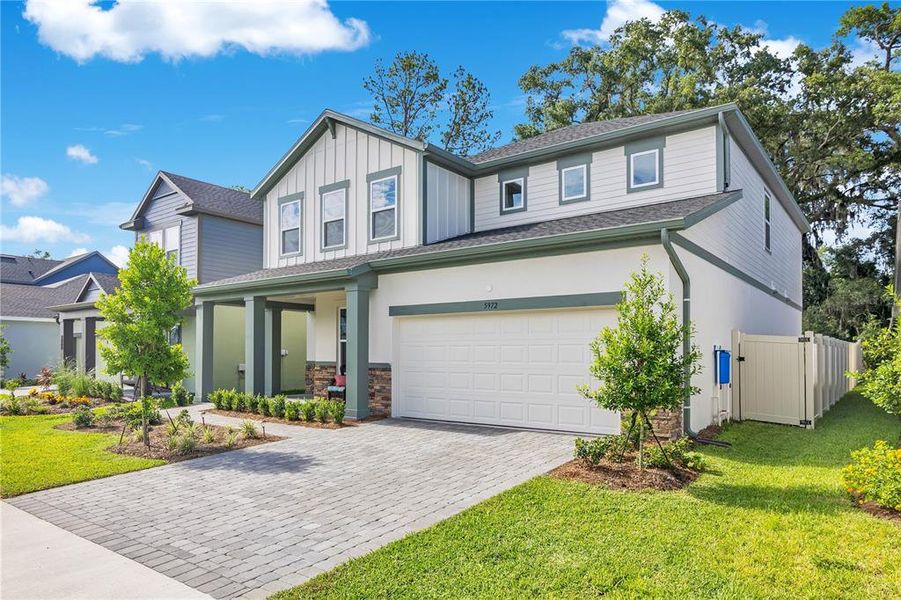 Front exterior of a new home in Oakfield at Mount Dora Village Series, Mount Dora, FL, highlighting curb appeal (Image 23).