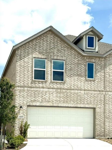 Front exterior of a new home in Sierra Vista, Rosharon, TX, highlighting curb appeal (Image 16).