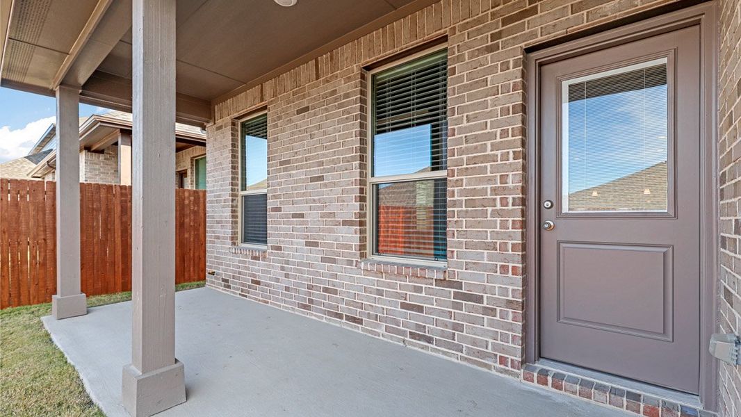 Exterior details and patio area of a home in Treeline, Justin (Image 2).