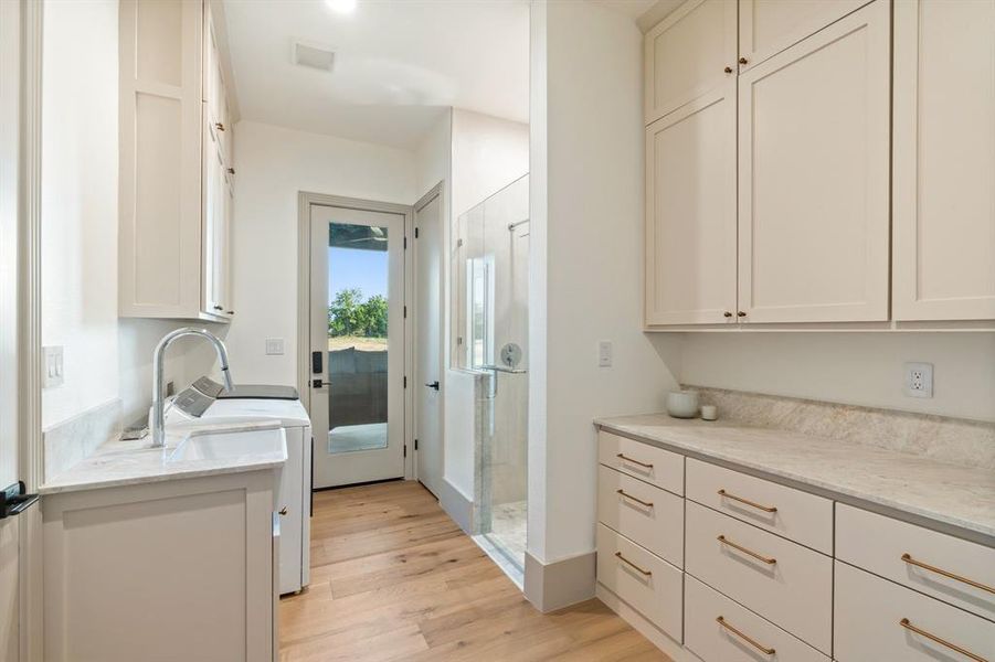 Laundry with built in cabinetry & mud room