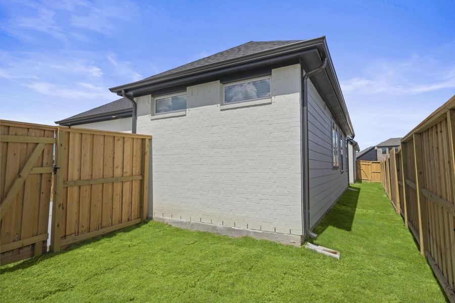 Exterior details and patio area of a home in Riceland, Mont Belvieu (Image 4). Exterior details and patio area of a home in Riceland, Mont Belvieu (Image 4).