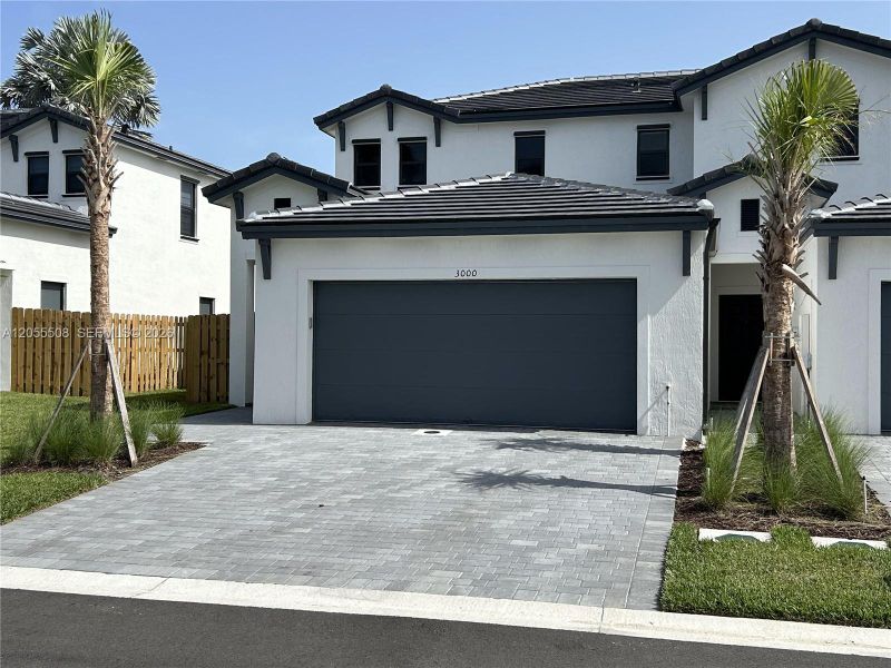 Front exterior of a new home in , Dania Beach, FL, highlighting curb appeal (Image 1). Front exterior of a new home in , Dania Beach, FL, highlighting curb appeal (Image 1).