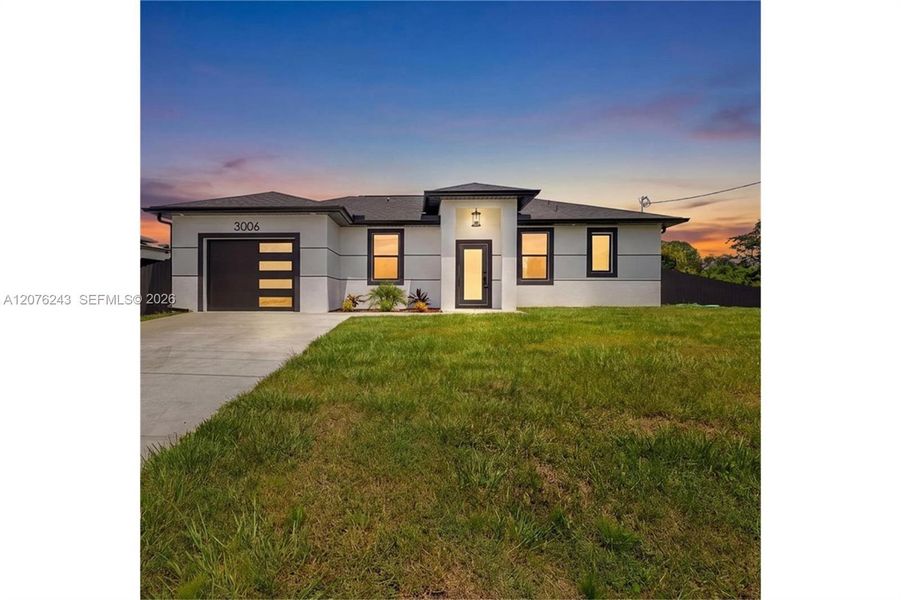 Front exterior of a new home in , Lehigh Acres, FL, highlighting curb appeal (Image 21).
