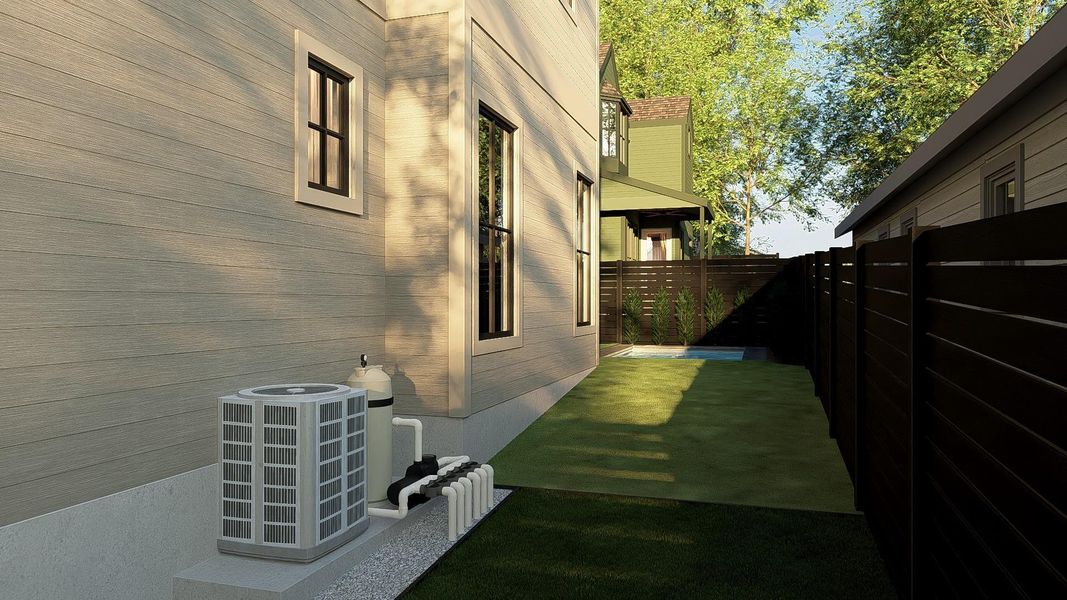 Additional yard space on the side of the house, perfect for a dog run.