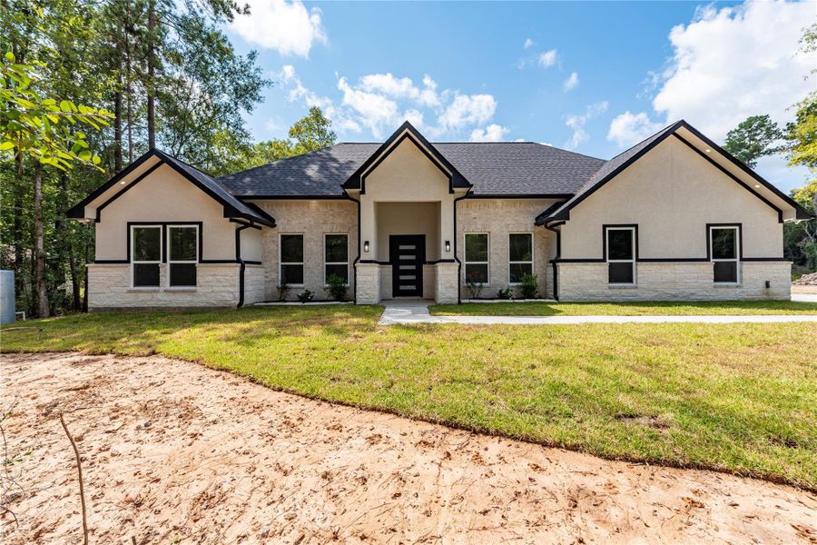 Front exterior of a new home in , Dayton, TX, highlighting curb appeal (Image 2).