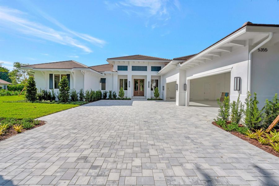 Front exterior of a new home in , Palm Beach Gardens, FL, highlighting curb appeal (Image 2).