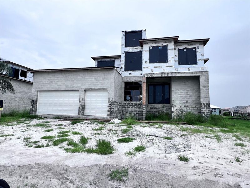 Front exterior of a new home in , Port Charlotte, FL, highlighting curb appeal (Image 9).
