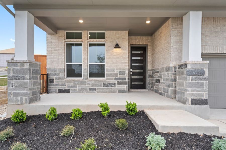 Exterior details and patio area of a home in Park Collection at Lariat, Liberty Hill (Image 3).