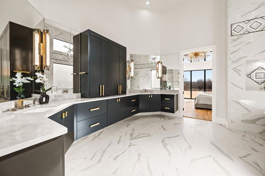 Bathroom featuring vanity and a towering ceiling