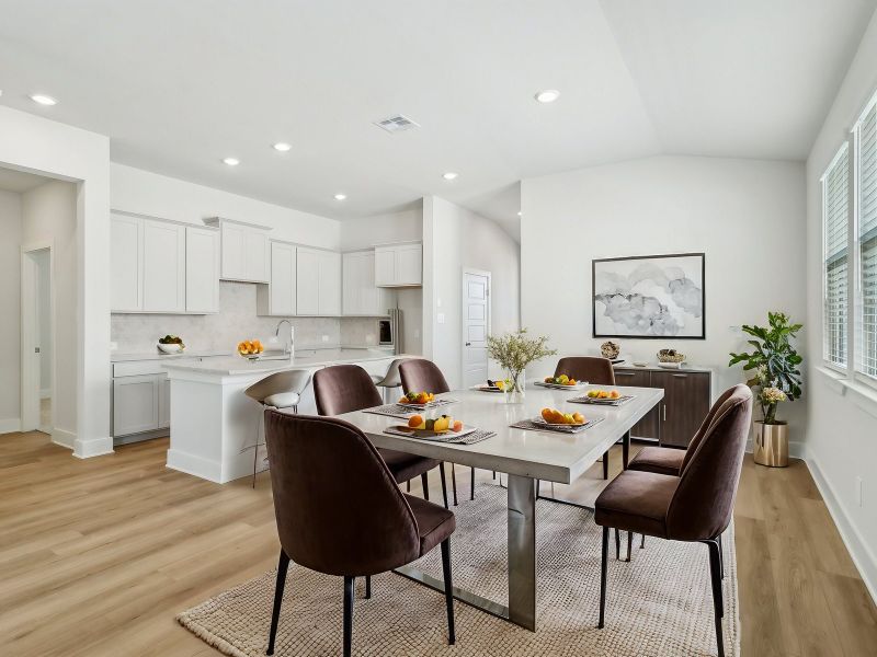 Virtually staged dining room in the San Saba floorplan at a Meritage Homes community.