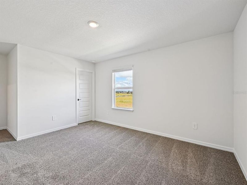 Spacious, unfurnished interior of a new home in Oakfield Trails - Signature Series, Parrish (Image 27).