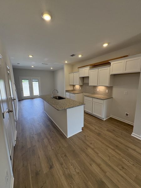 Photo is of the model home to show what the completed floor plan looks like. Selections and Options may vary. ALL STAINLESS STEEL KITCHEN APPLIANCES WILL BE INCLUDED