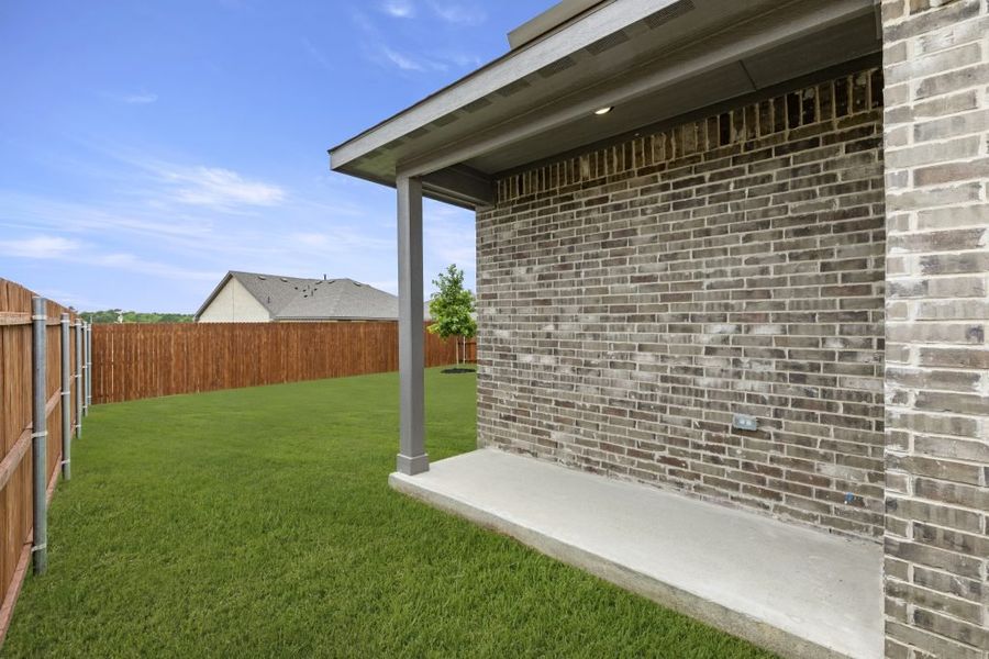 Representative exterior photo of a completed home built from the Cottonwood by Impression Homes in Northspur, Terrell, TX (Image 26).