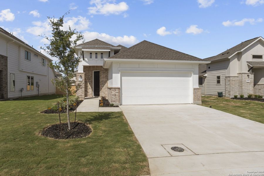 Front exterior of a new home in Rhine Valley, Schertz, TX, highlighting curb appeal (Image 18).